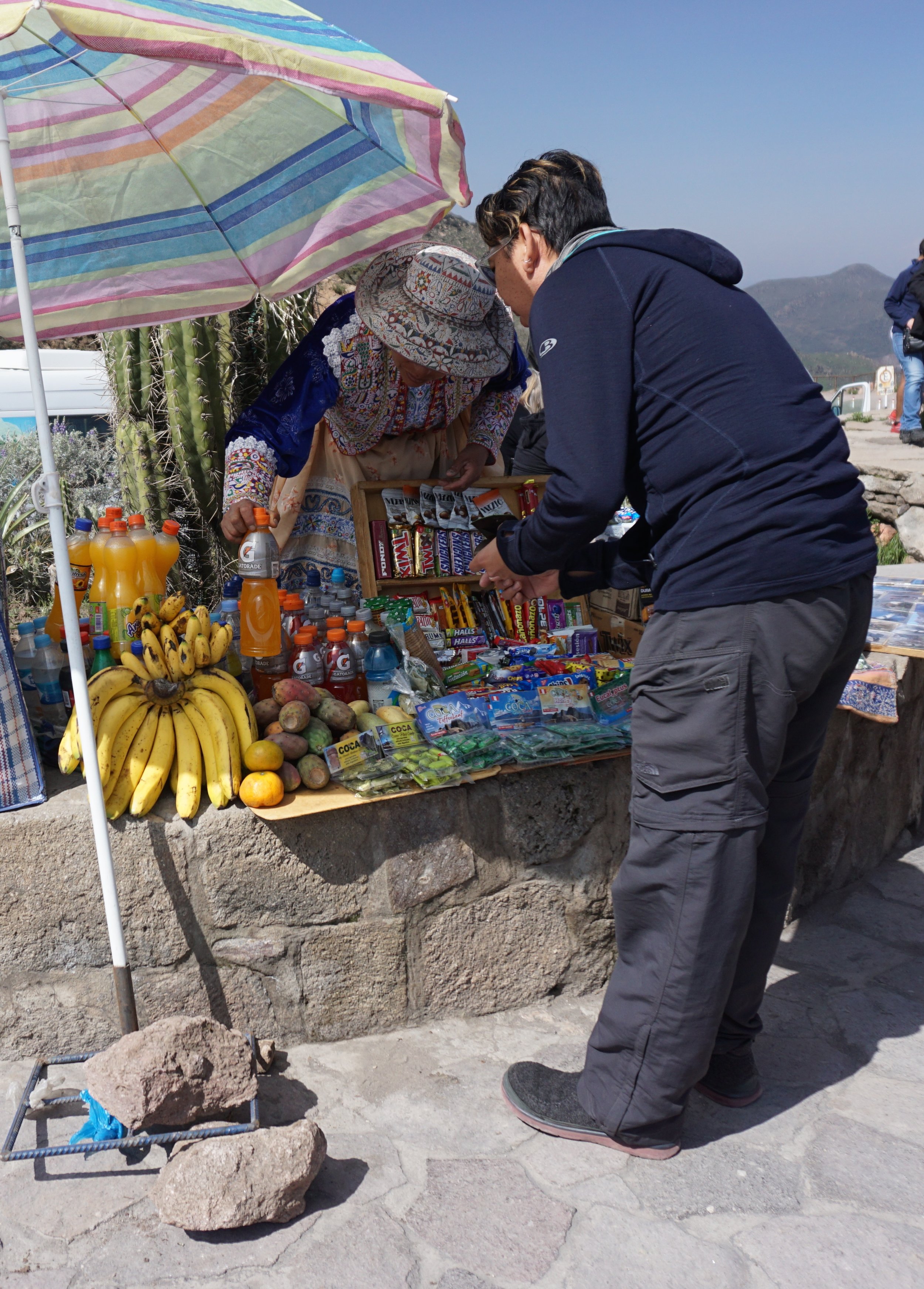  J wheeling and dealing with a vendor at Cruz del Condor 