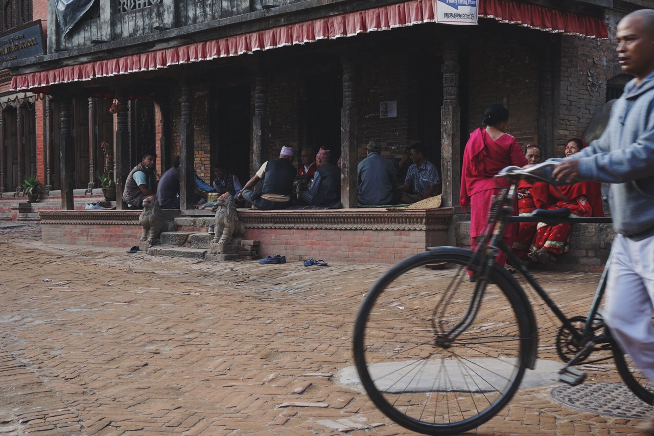  A gathering of Nepali men under the eave of building near Durbar Square 