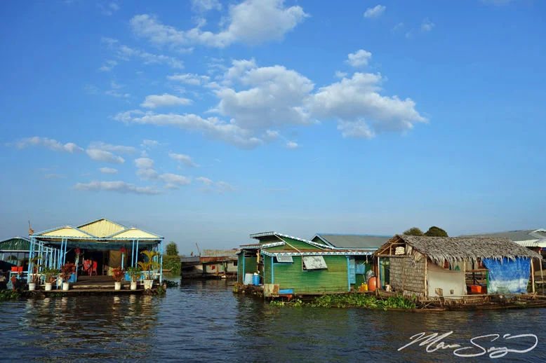 Floating village near Chau Doc, Vietnam. These people live in their floating houses year round. In some of the larger floating villages, they even have buildings for gas stations, schools, salons, etc... it's really interesting taking a boat through and seeing how these people live on the water!