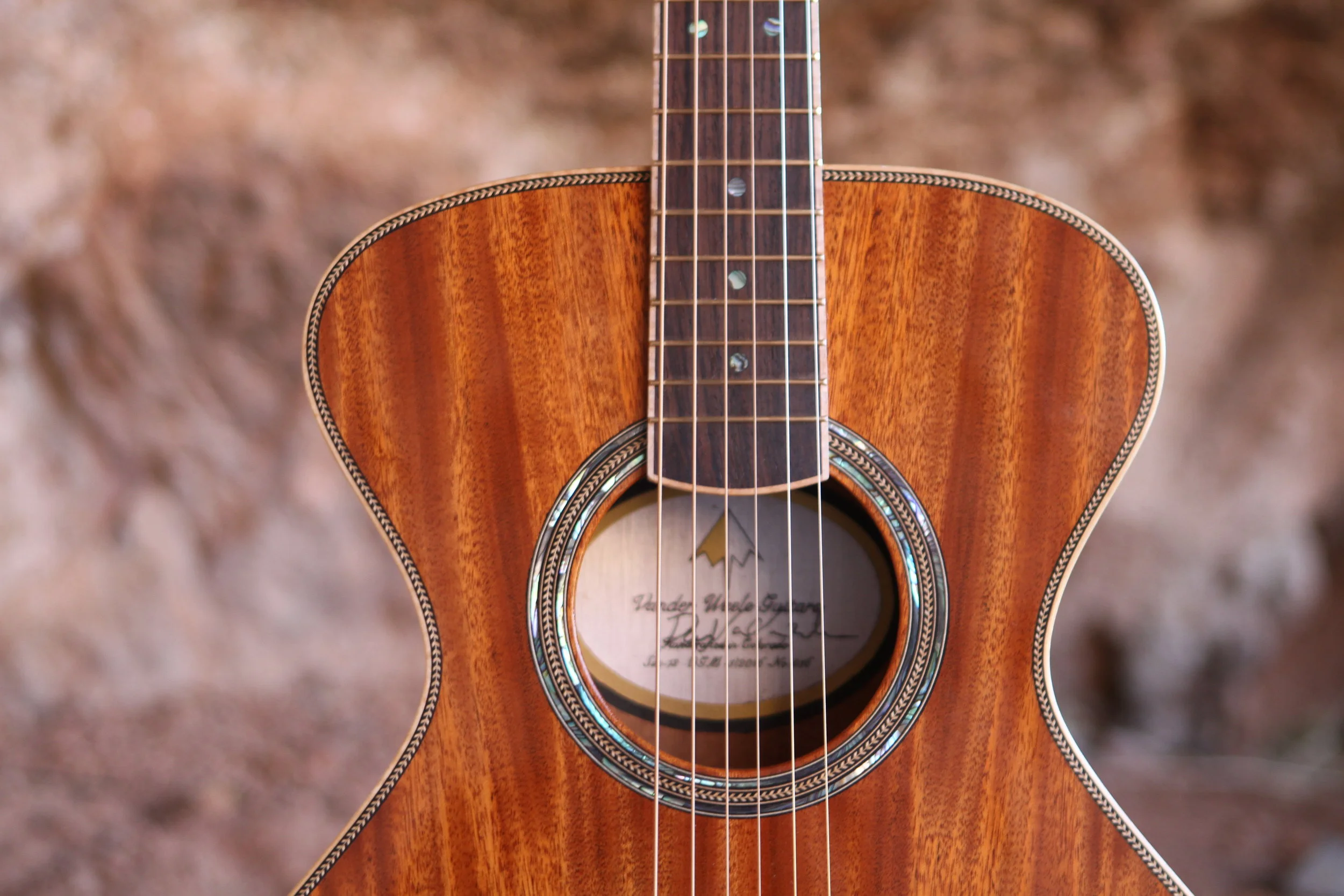  Original Guitar Mahogany or OGM will have you playing all night with a beautiful rich sound of Honduras Mahogany top and accents of abalone rosette and herringbone purling. It's sure to be a classic. OGM model 