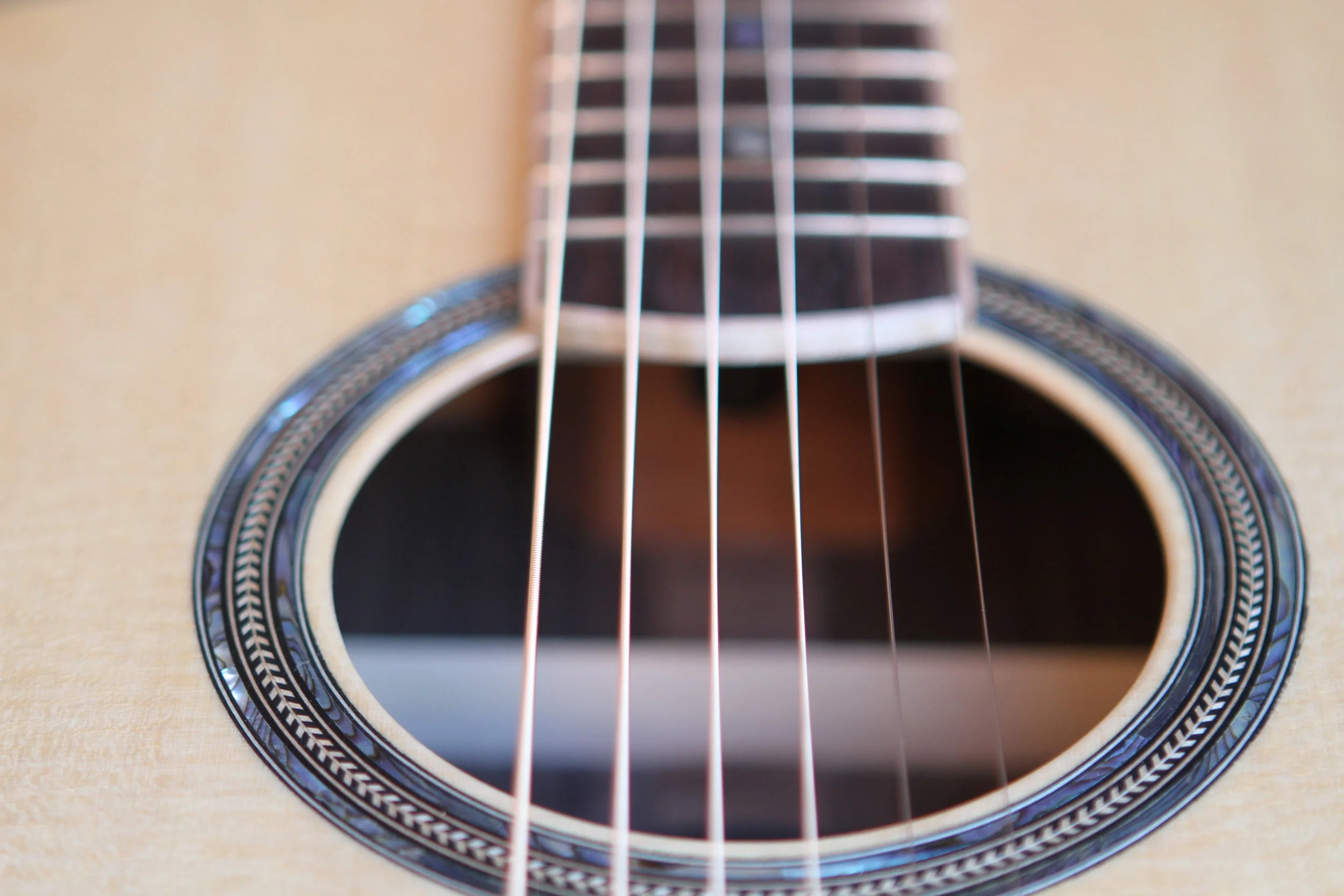  Sitka spruce Top with a classic element of the 5 ring abalone/herring bone rosette. OG model (original guitar model). 