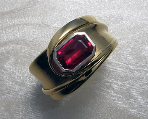 Fluid freeform band with ruby.