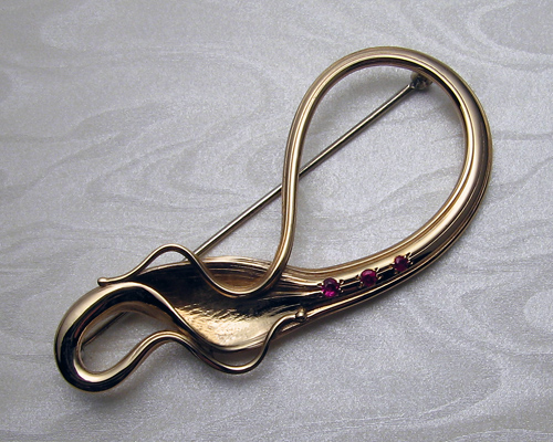 Musical, Art Nouveau, free-form ruby brooch.