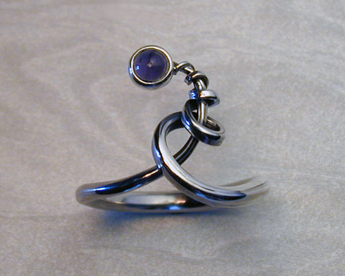 Feeform spiral ring with iolite stone.