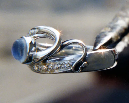Organic, musical, freeform engagement ring with blue moonstone.