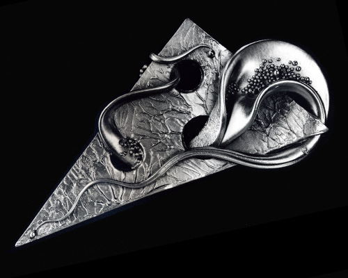 Very fluid, very organic, freeform brooch lapel pin.