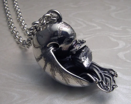 Handcrafted nautilus shell pendant.