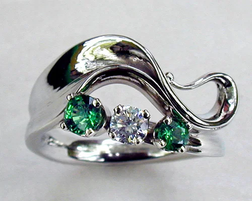 Wave-like freeform engagement ring.