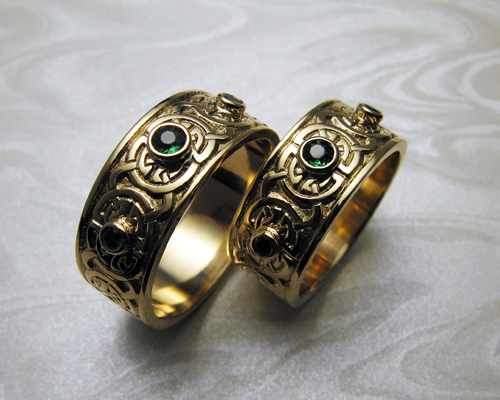 Celtic wedding bands, with green garnets.