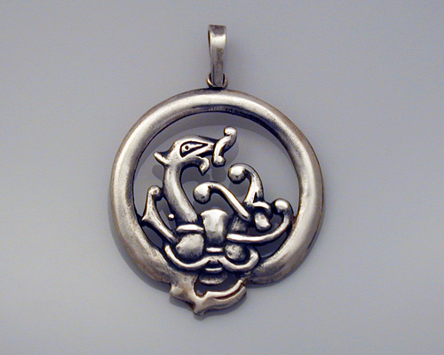 Round, Norse dragon pendant.