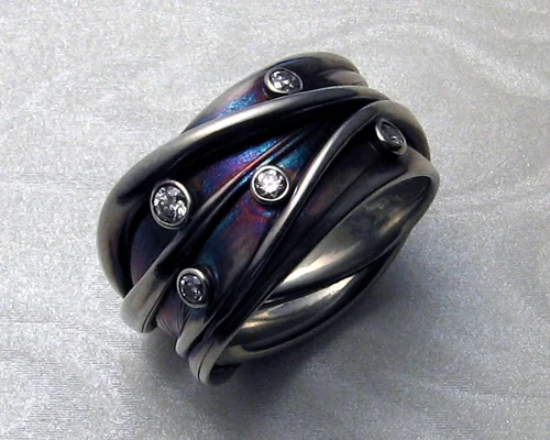 Interwoven multiple strand freeform band.