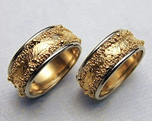 Wedding rings with spherical granulation and branch like textures.