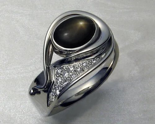 Fluid, organic, freeform, ladies ring with black star sapphire.