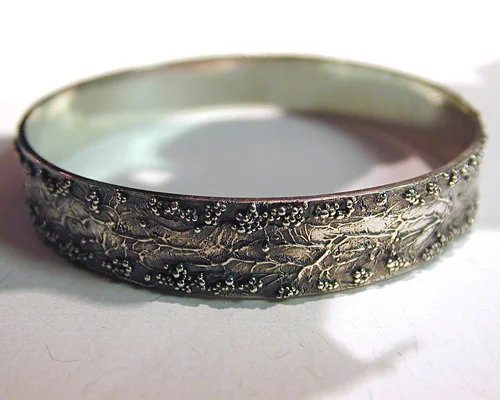 Handcrafted organic free-form bangle.