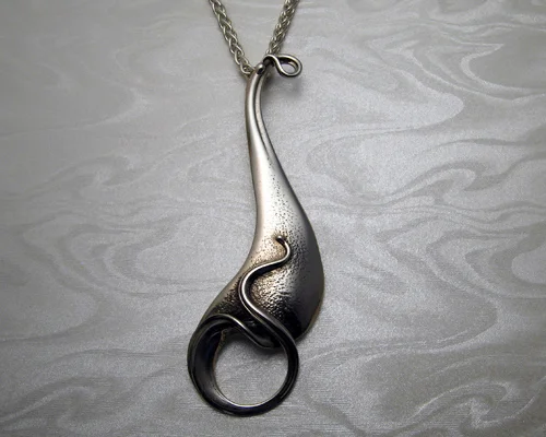 Free-form, Art Nouveau drop pendant.