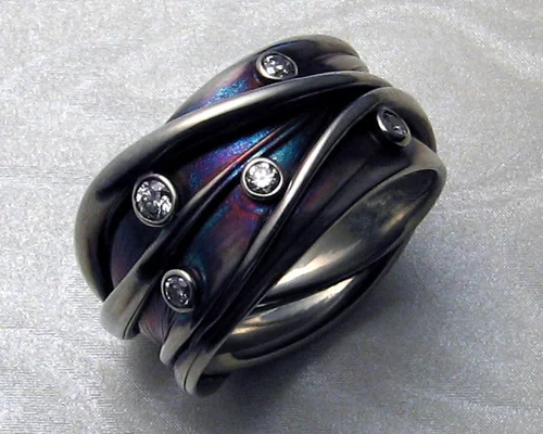 Organic, interwoven multiple strand free-form band.