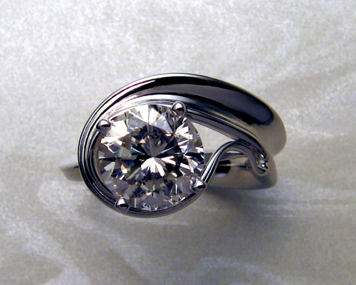 Unusual, asymmetrical, engagement ring.