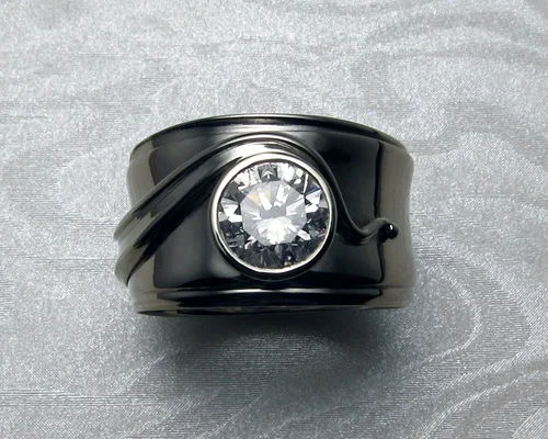 Wide, free-form engagement band with diamond.