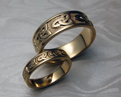 Matching Celtic bands, with trinity knot-work.