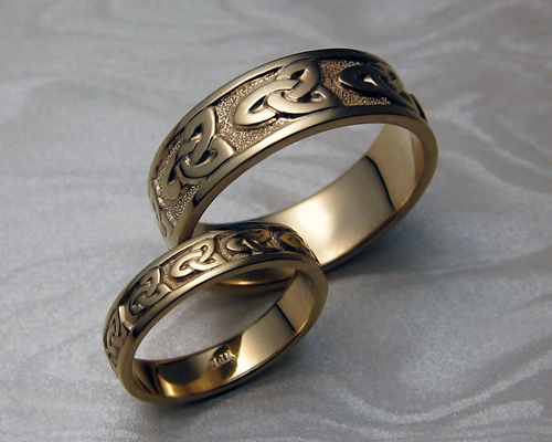 Matching Celtic bands, with  trinity knot-work.