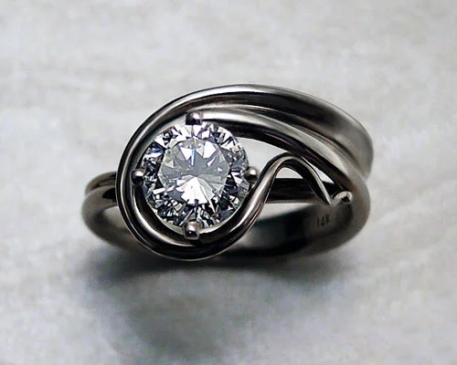 very_unique_beautiful_asymmetrical_engagement_ring.jpg