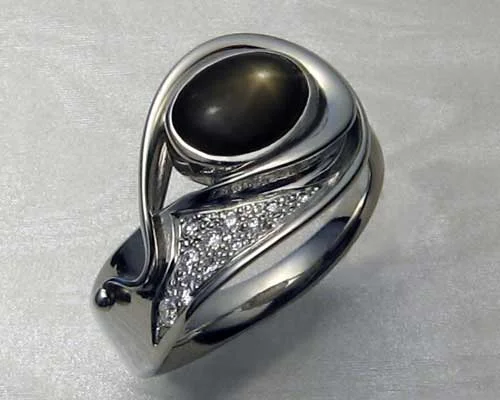 Fluid, organic, freeform, ladies ring with black star sapphire.