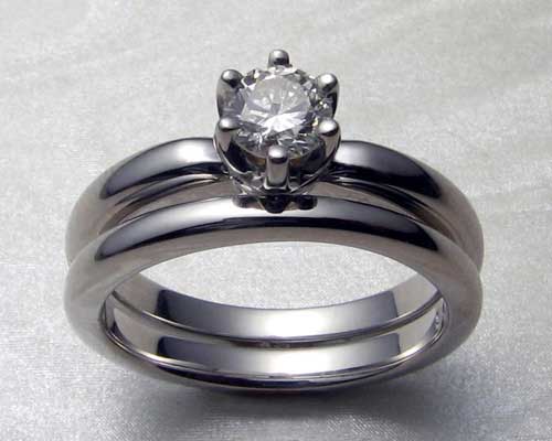 Solitaire engagement ring with matching band.