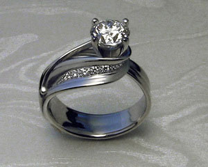 Custom made, ribbon-like, engagement ring.