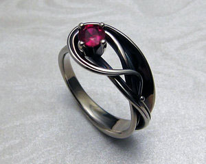 Art-nouveau style engagement ring with ruby.