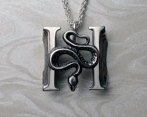 Headstones pendant from large Headstone ring.