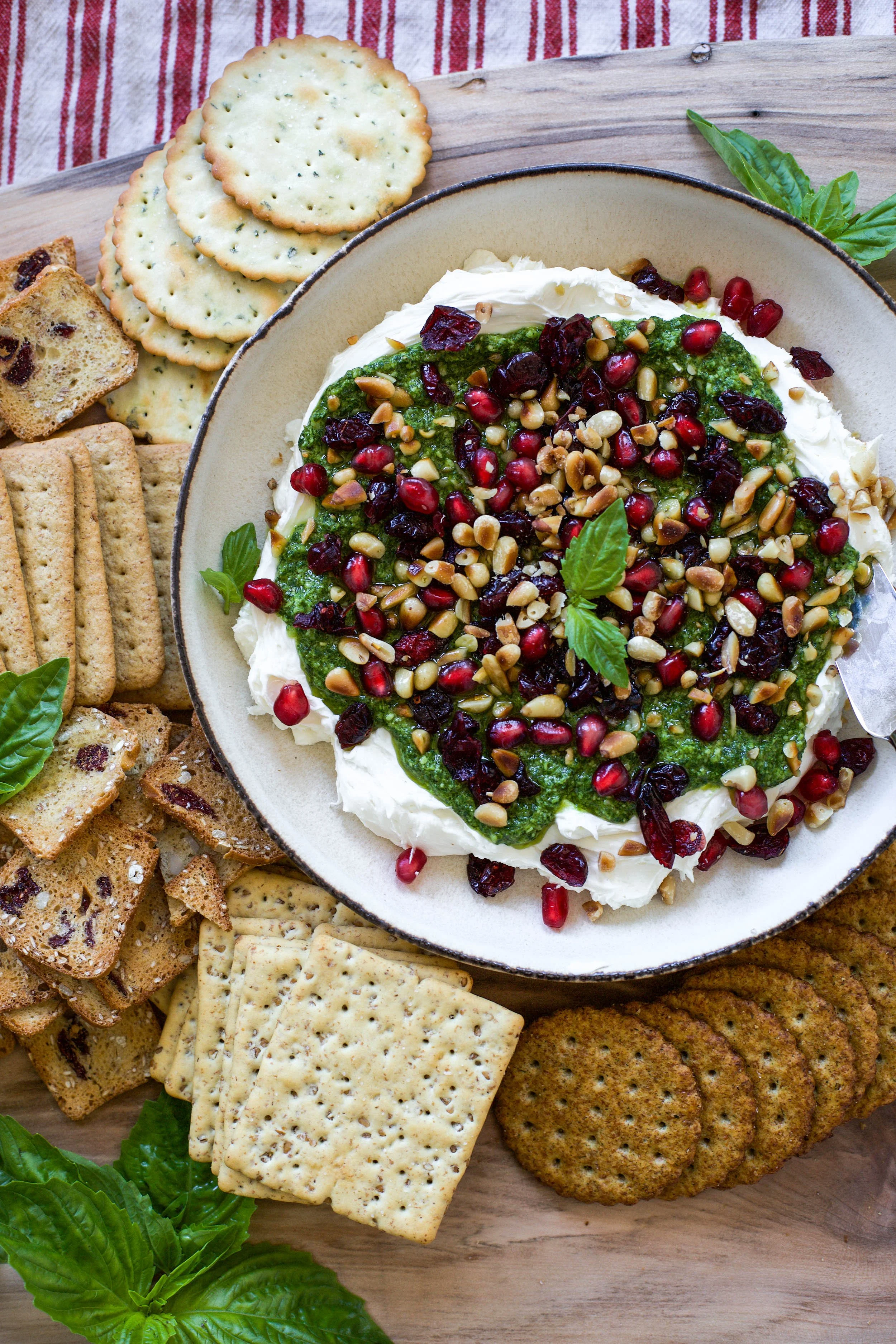 Pesto and Goat Cheese Spread with Cranberries and Toasted Pine Nuts