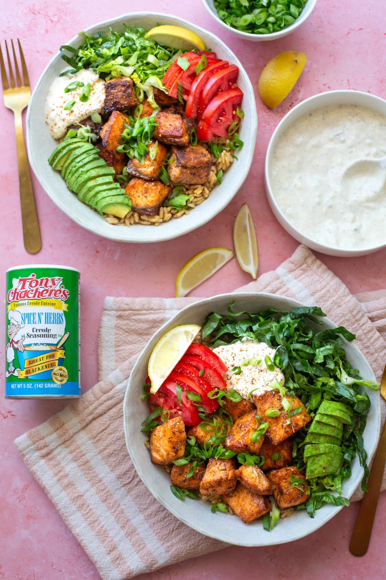 Bowls of prepped blackened salmon rice bowls with all of the fixings.