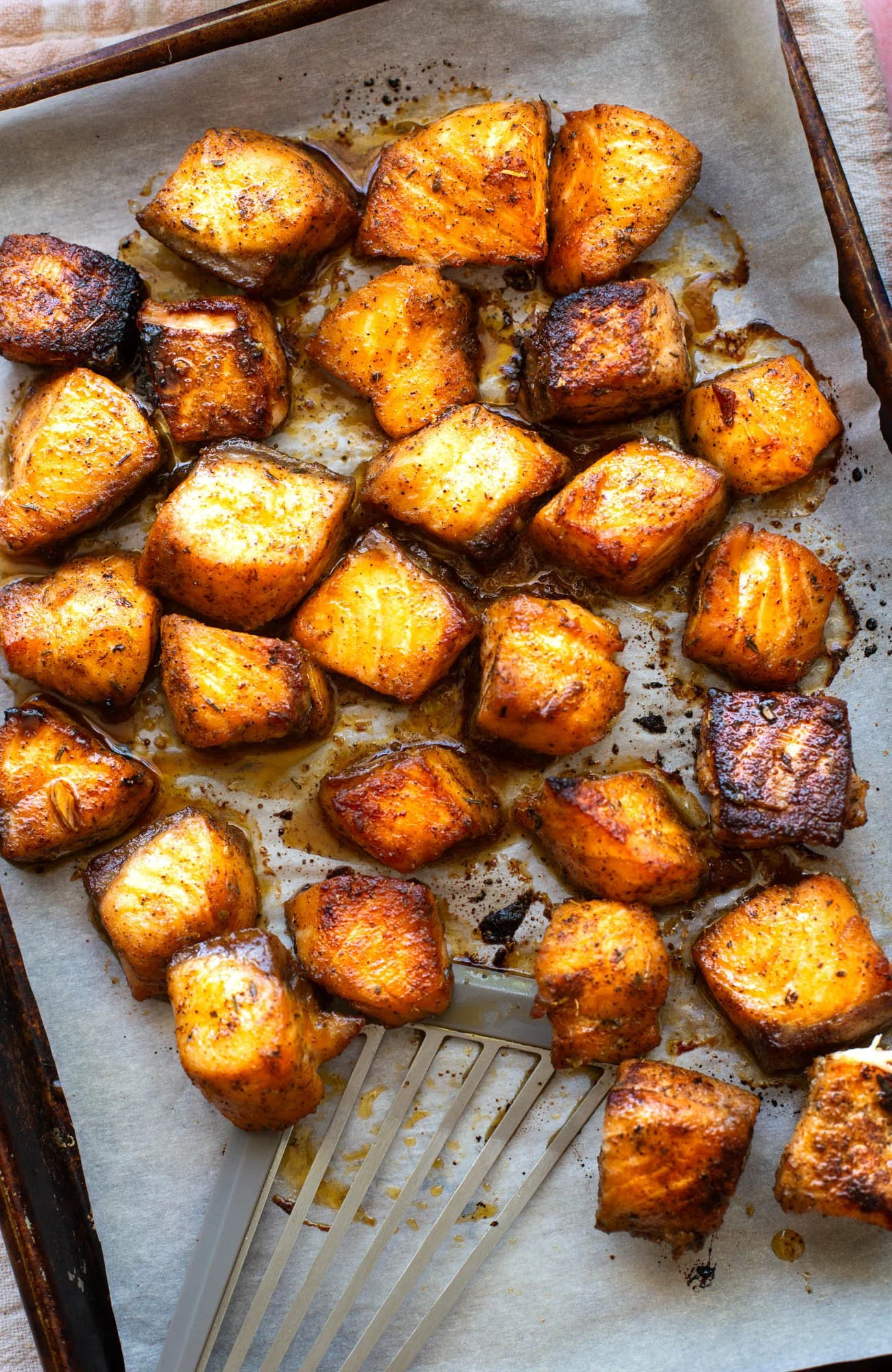 Close up shot of the cooked blackened salmon cubes.