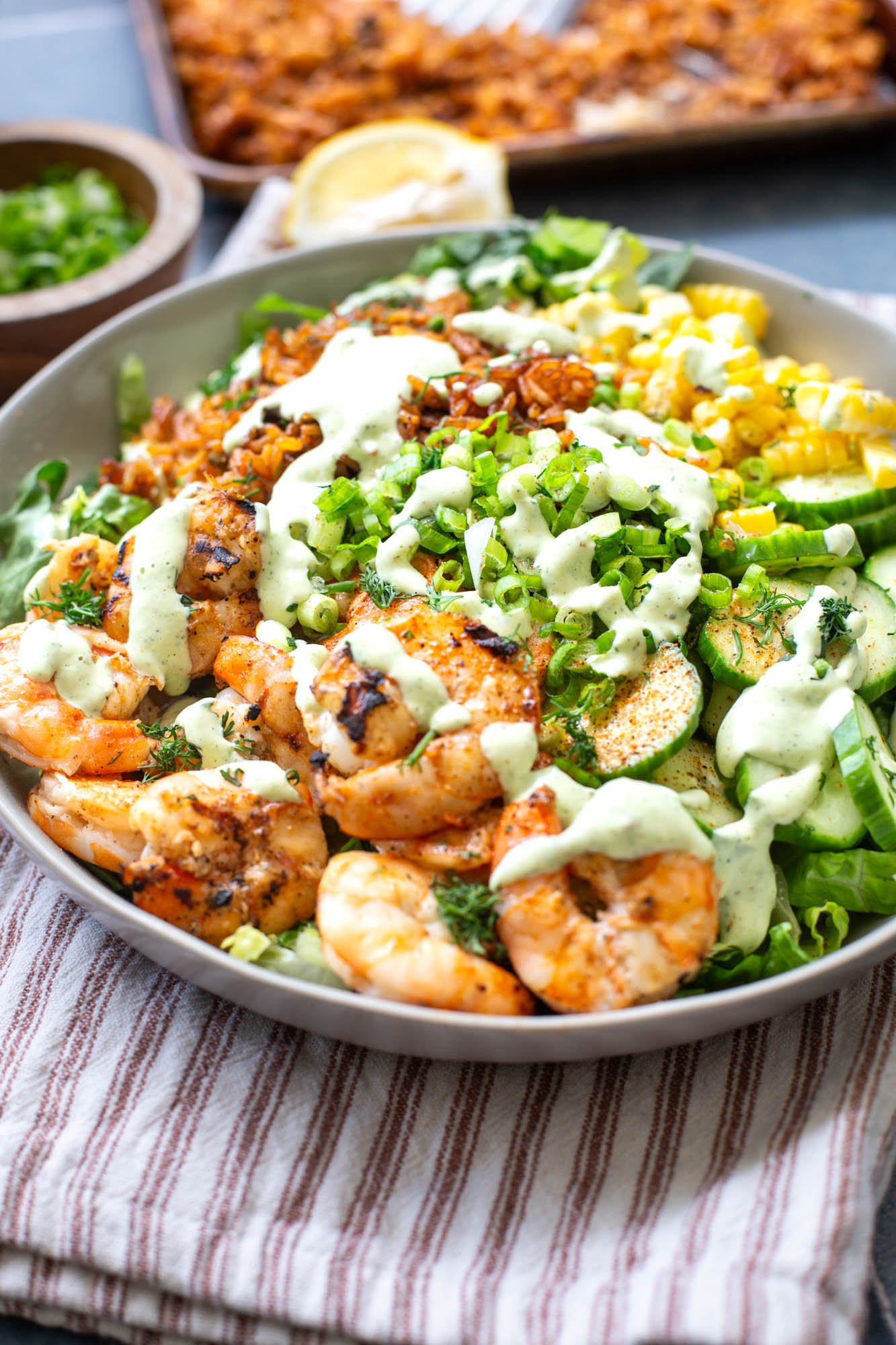 Cajun grilled shrimp salad with crispy rice and a creamy dressing.