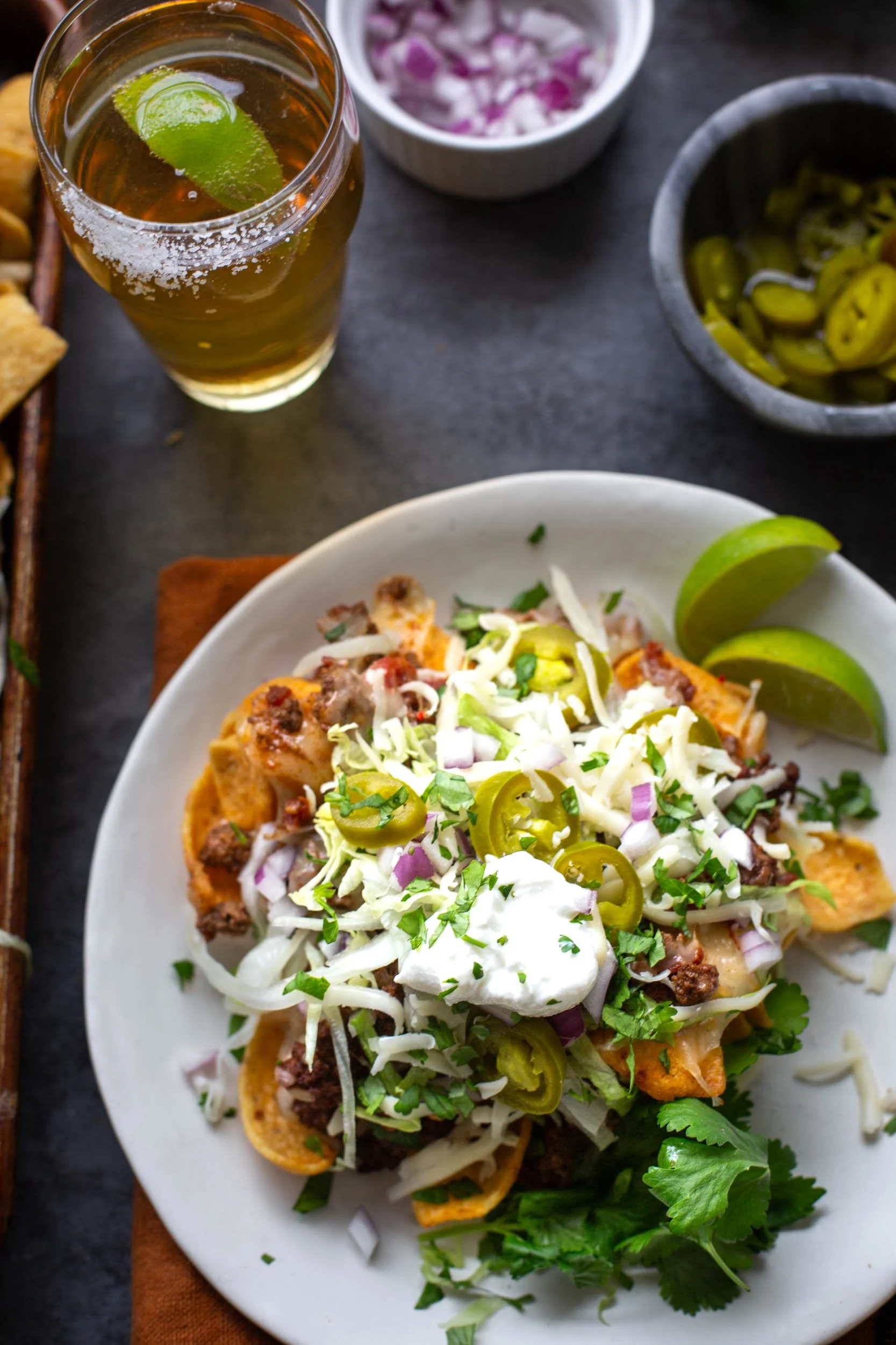 Plated sheet pan walking tacos with plenty of fresh toppings.