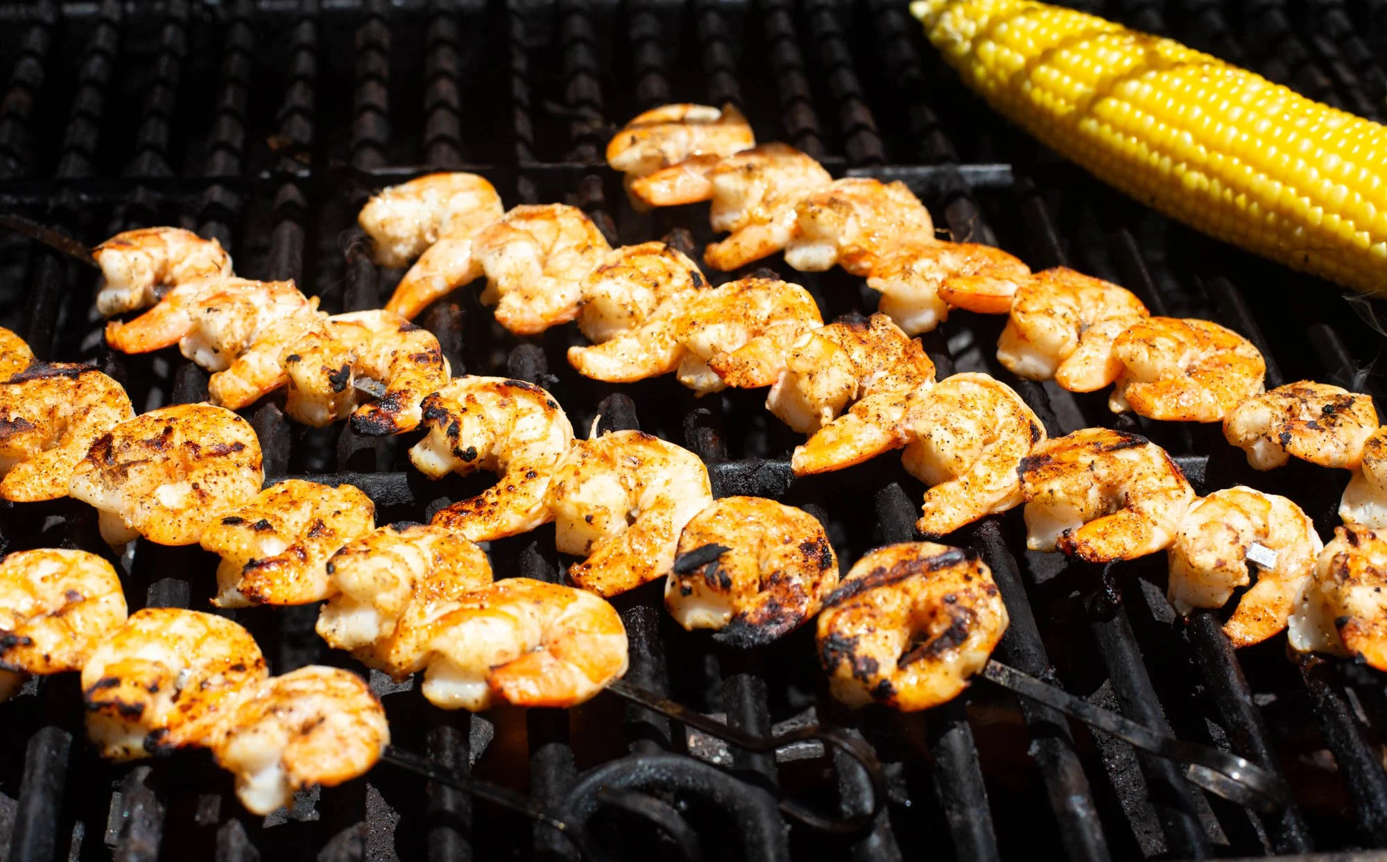 Cajun shrimp and corn on the grill.