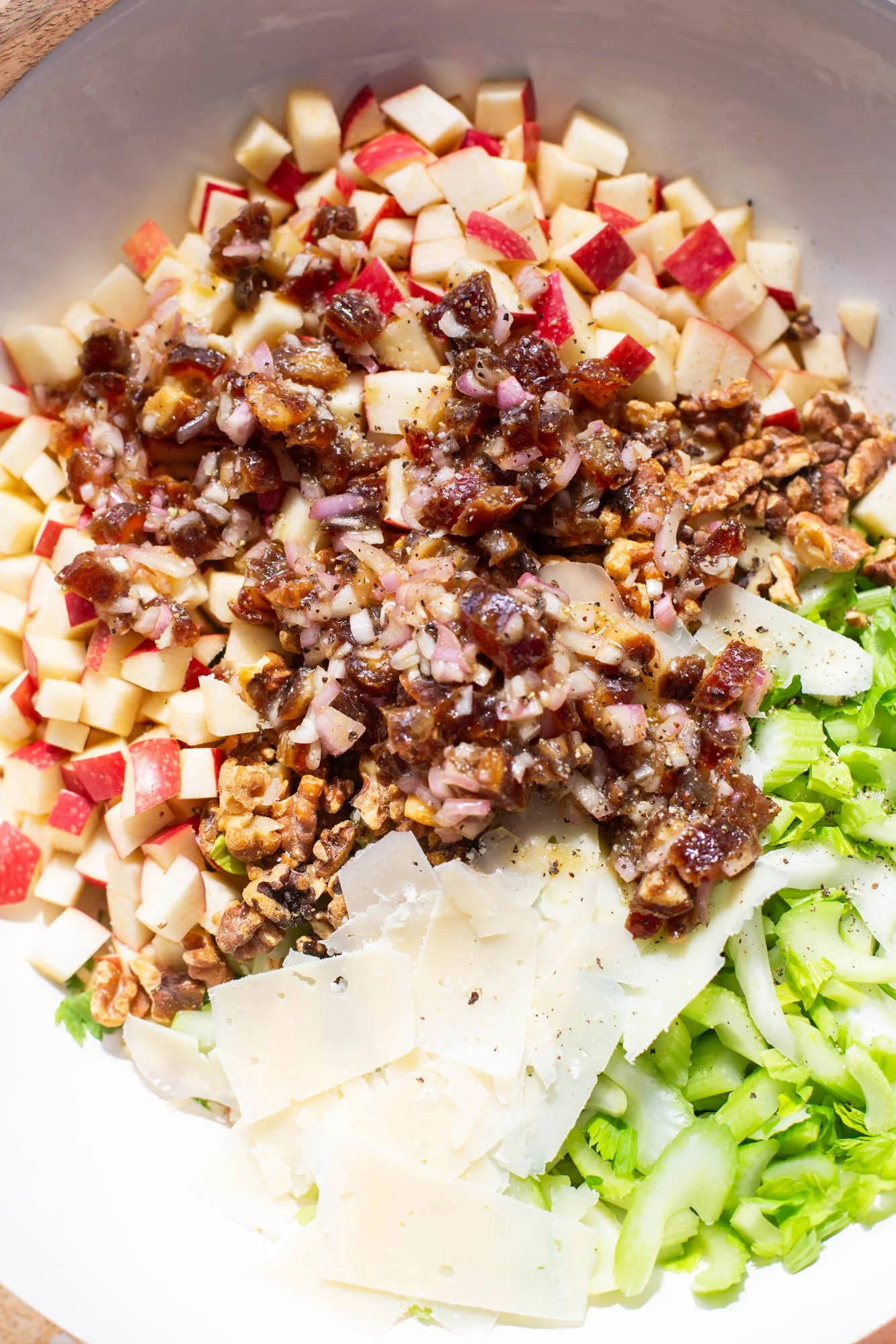 Date, lemon, and shallot dressing on top of the celery and apple salad.
