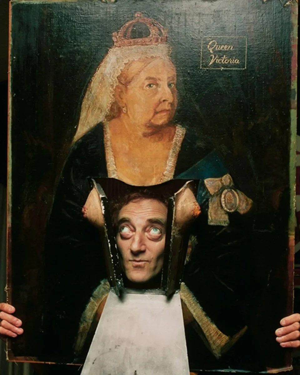 Marty Feldman sticking his head through a painting of Queen Victoria