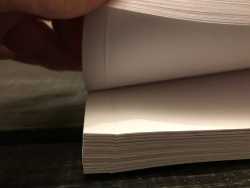 2: We pre-crease the paper, 1 cm in along the binding edge. The make our books flexible while still using a thicker paper. 