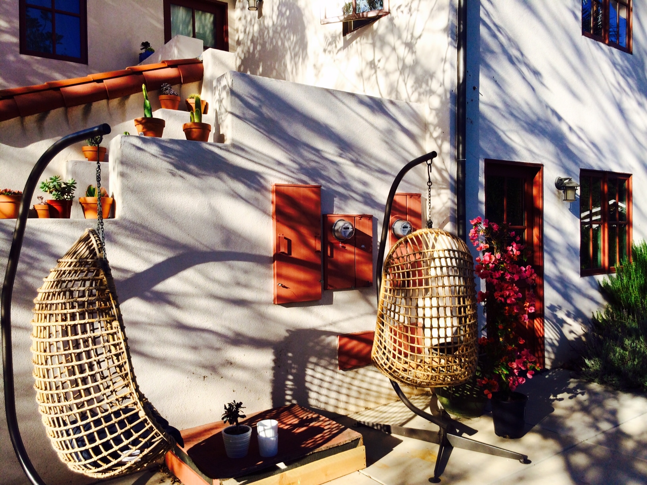 Vintage hanging wicker chairs--Las Vegas find. Metal Stands--Target find.