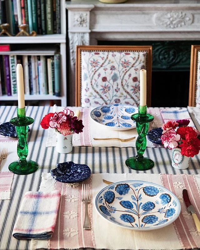 caroline-irving-and-daughters-home-place-setting-table-plates-blue-and-white-green-glass-candlesticks-seashell-striped-tablecloth.jpg