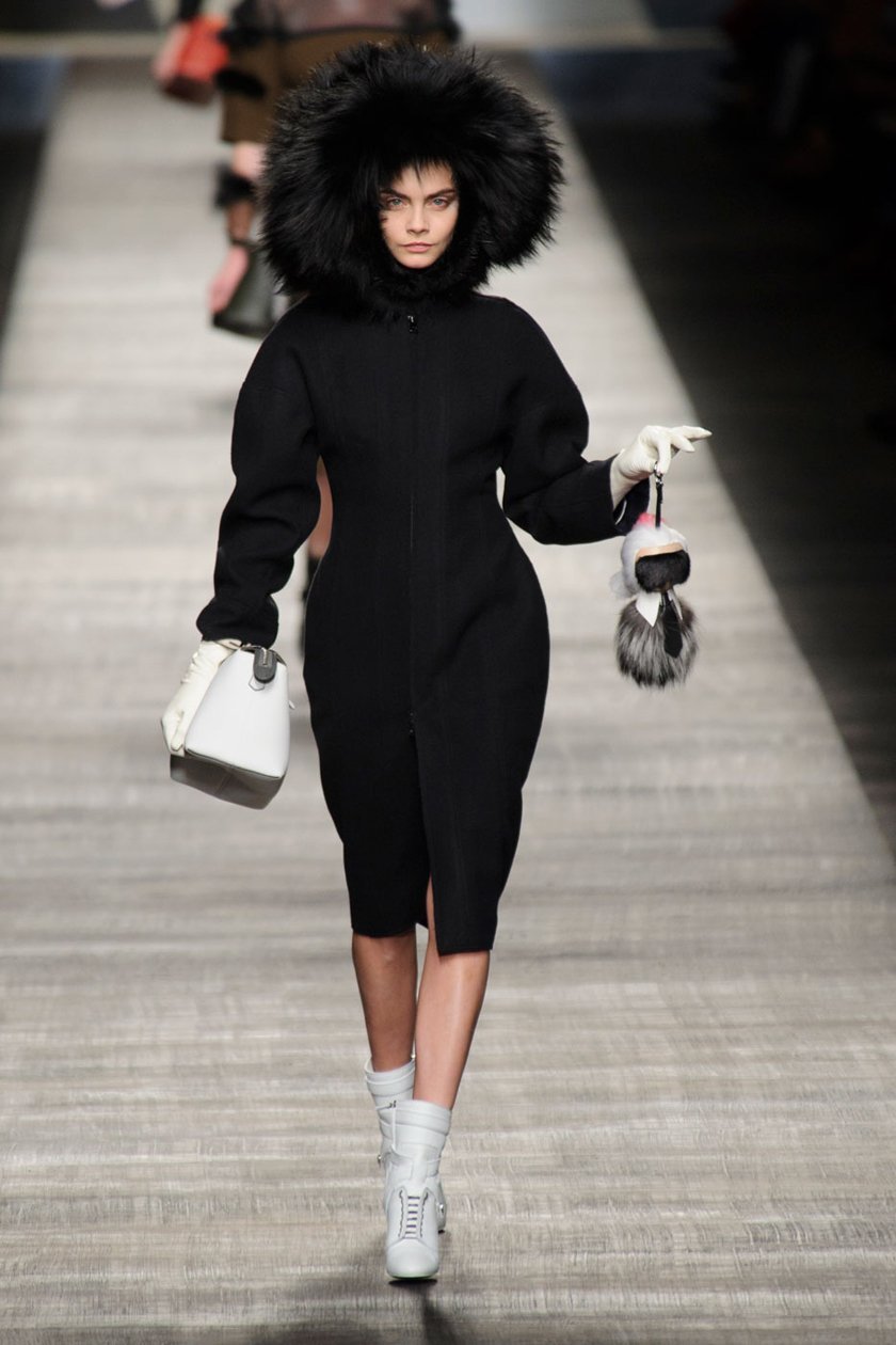 Cara Delevingne carrying Karlito down the runway, which retails at $1,650.