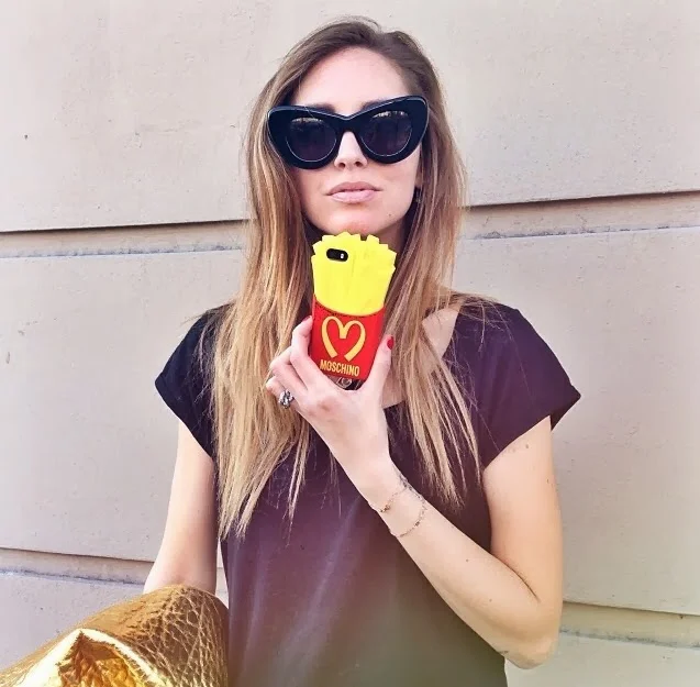 Chiarra Ferragni showing off her Moschino iPhone case. Are you going to eat that though? Because I can buy you real fries for A LOT cheaper. 