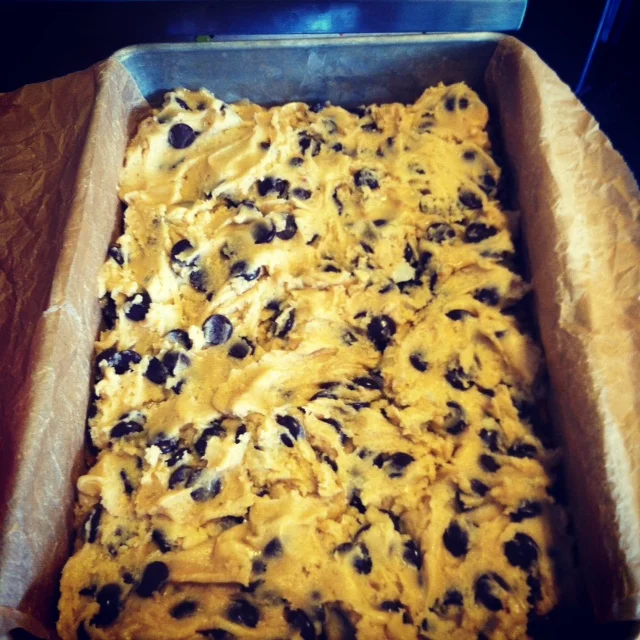 Cookie Dough layered on top of the pretzel crust just before baking