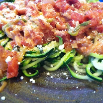 Zucchini "pasta" with a simple summer red sauce (tomatoes, sweet onion and basil)