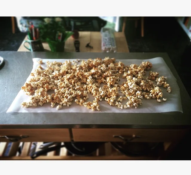Cooling the hot popcorn before we dig in.