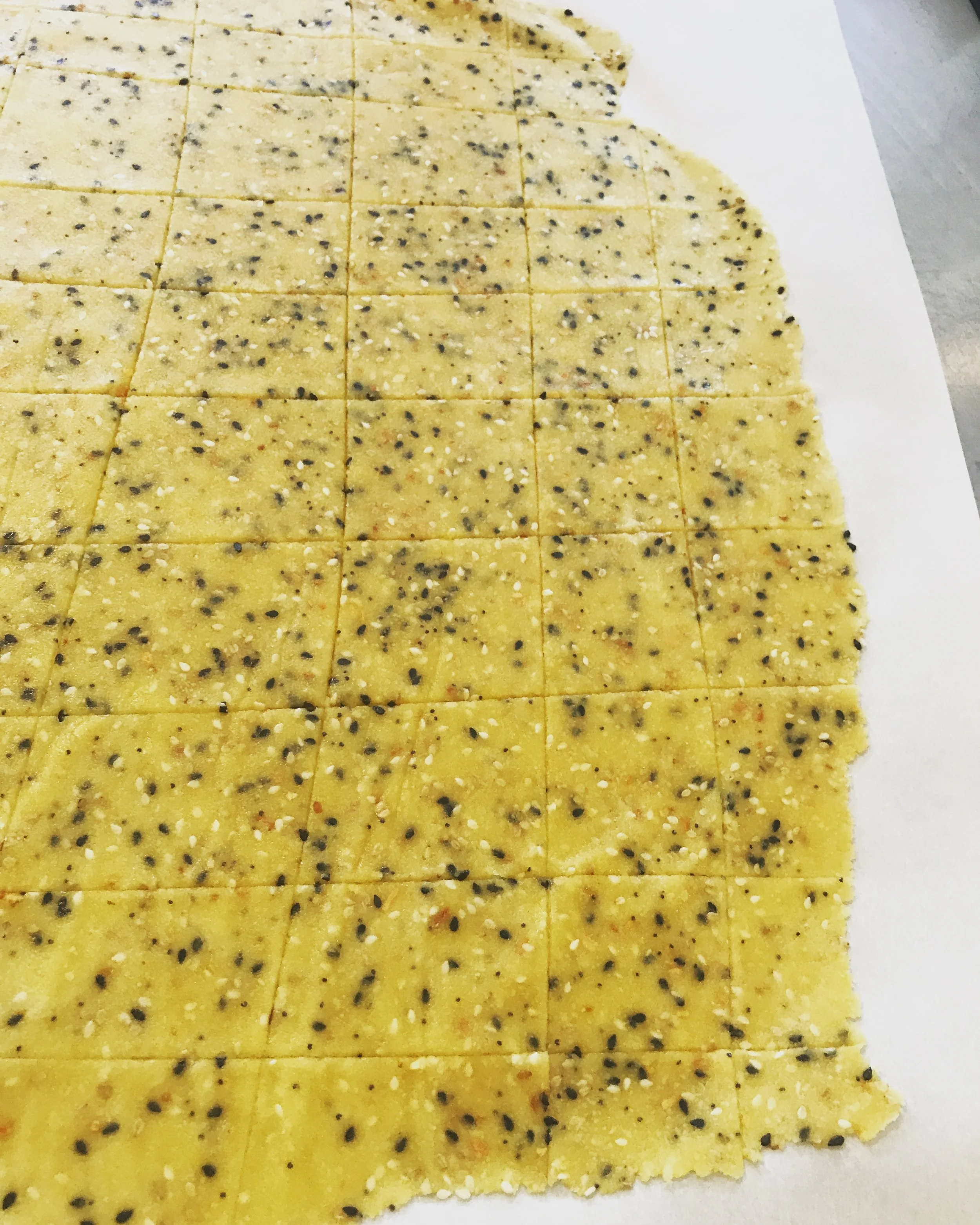 Rolling out the cracker dough.