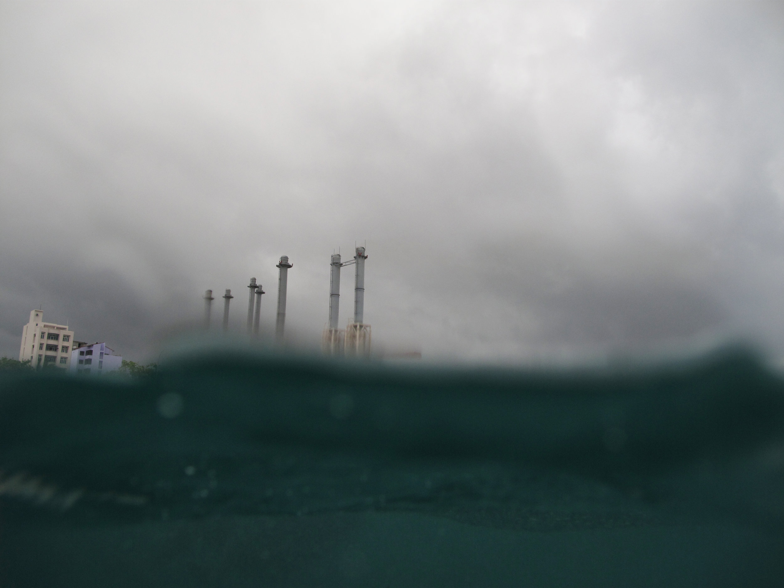 The STELCO towers from the water on a stormy day. Canon PowerShot G10 (2009)