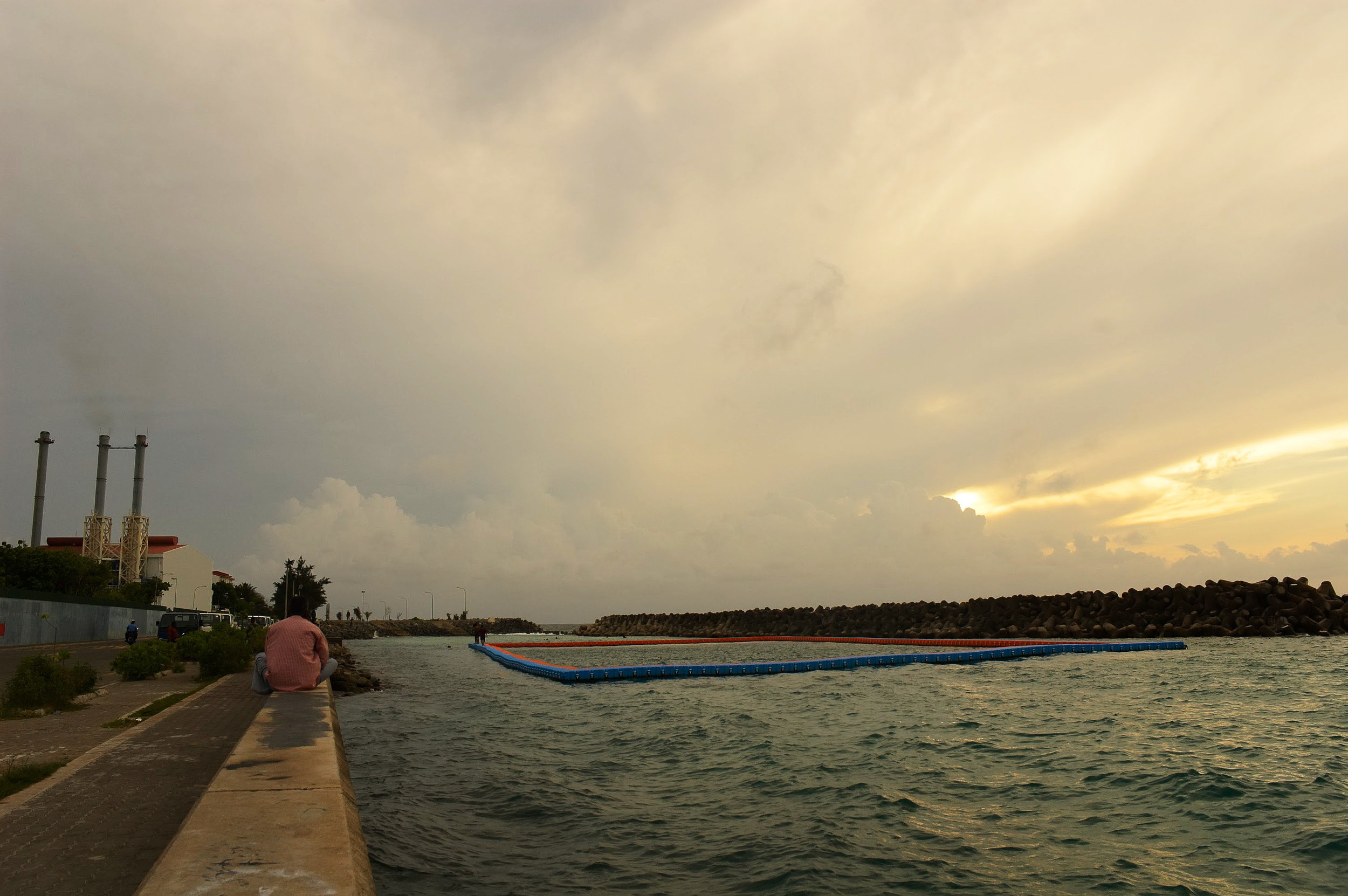 The track side on the left of the barrier.