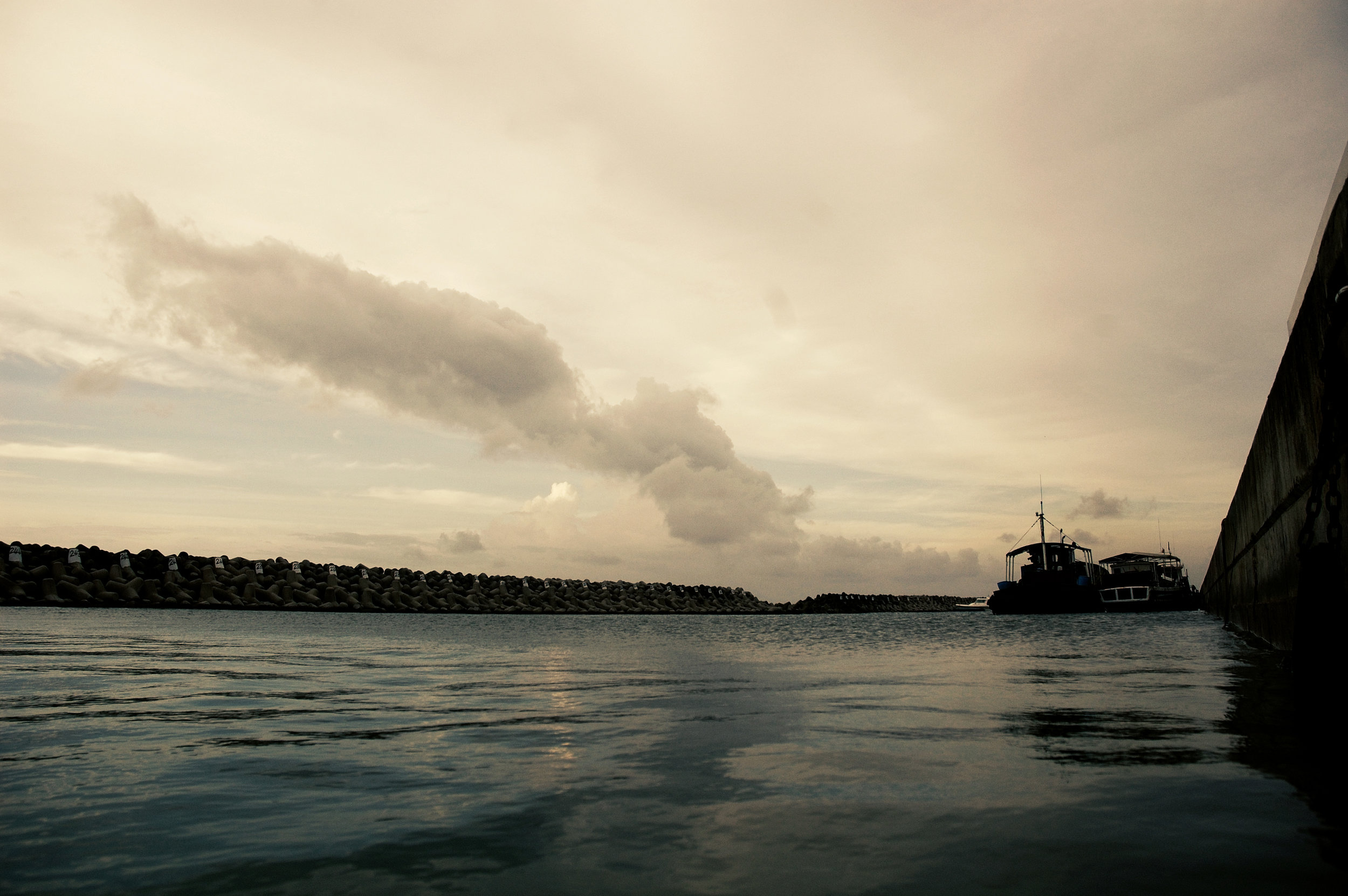 The harbour side on the right of the barrier.